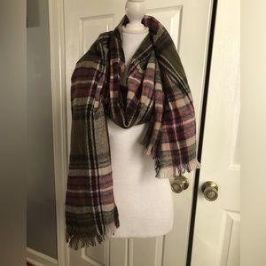 Women’s 100% acrylic scarf with colors of burgundy, green, tan, and more.